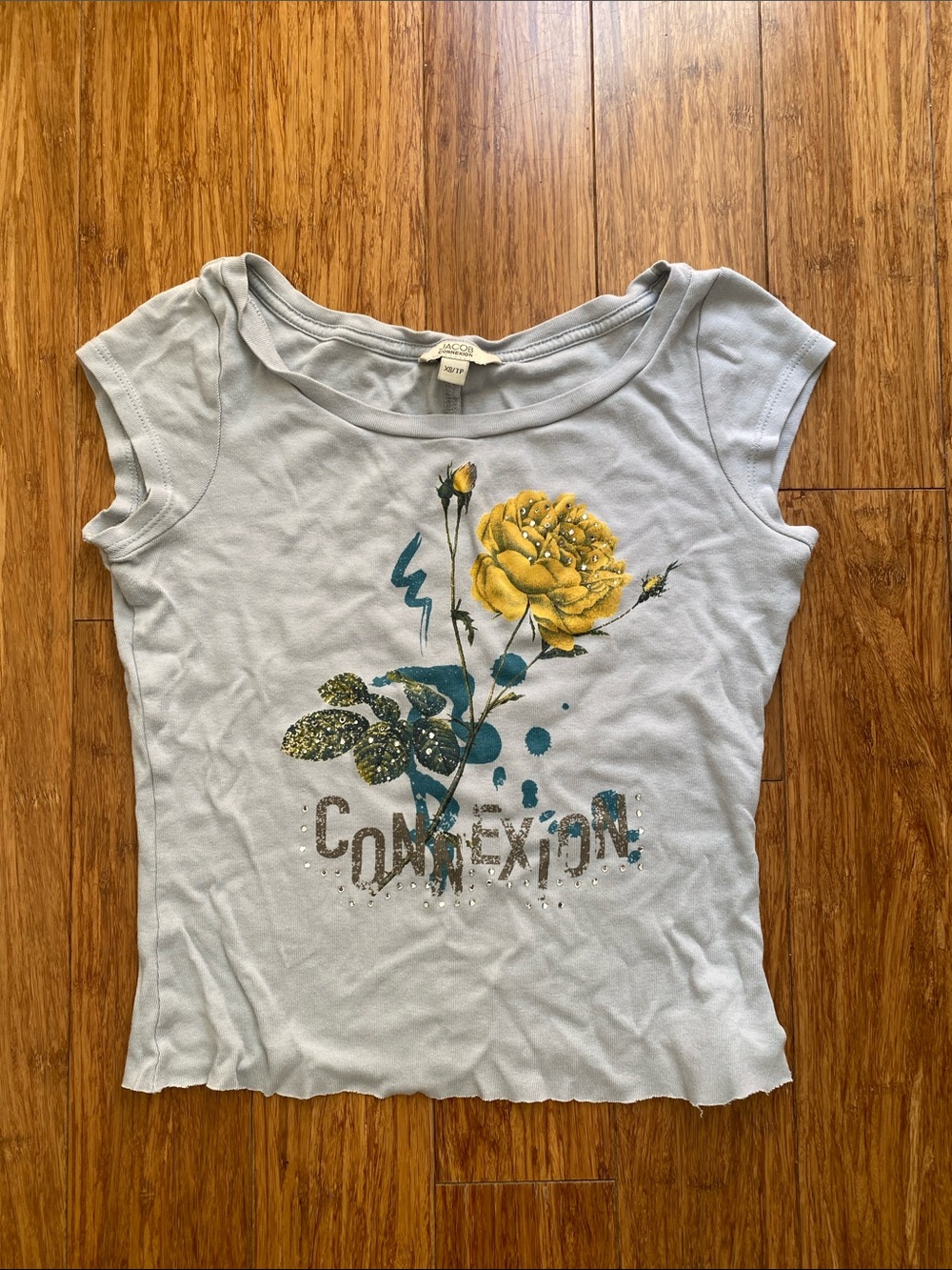 Women’s Light Blue Graphic Baby Tee with Yellow Rose -